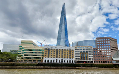 The Shard and London Bridge Hospital viewed from the Thames on a sightseeing cruise.