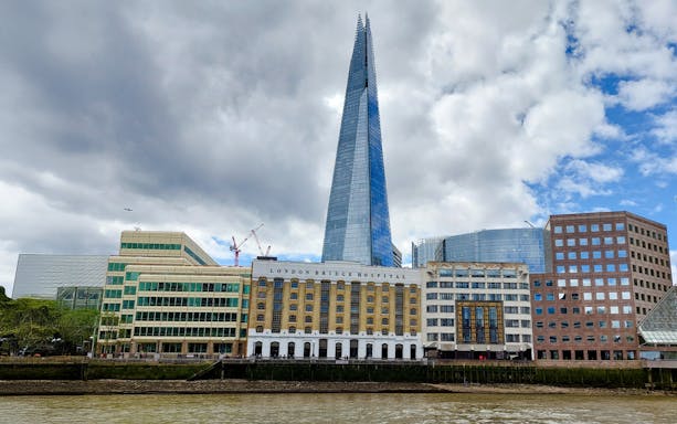 The Shard and London Bridge Hospital viewed from the Thames on a sightseeing cruise.