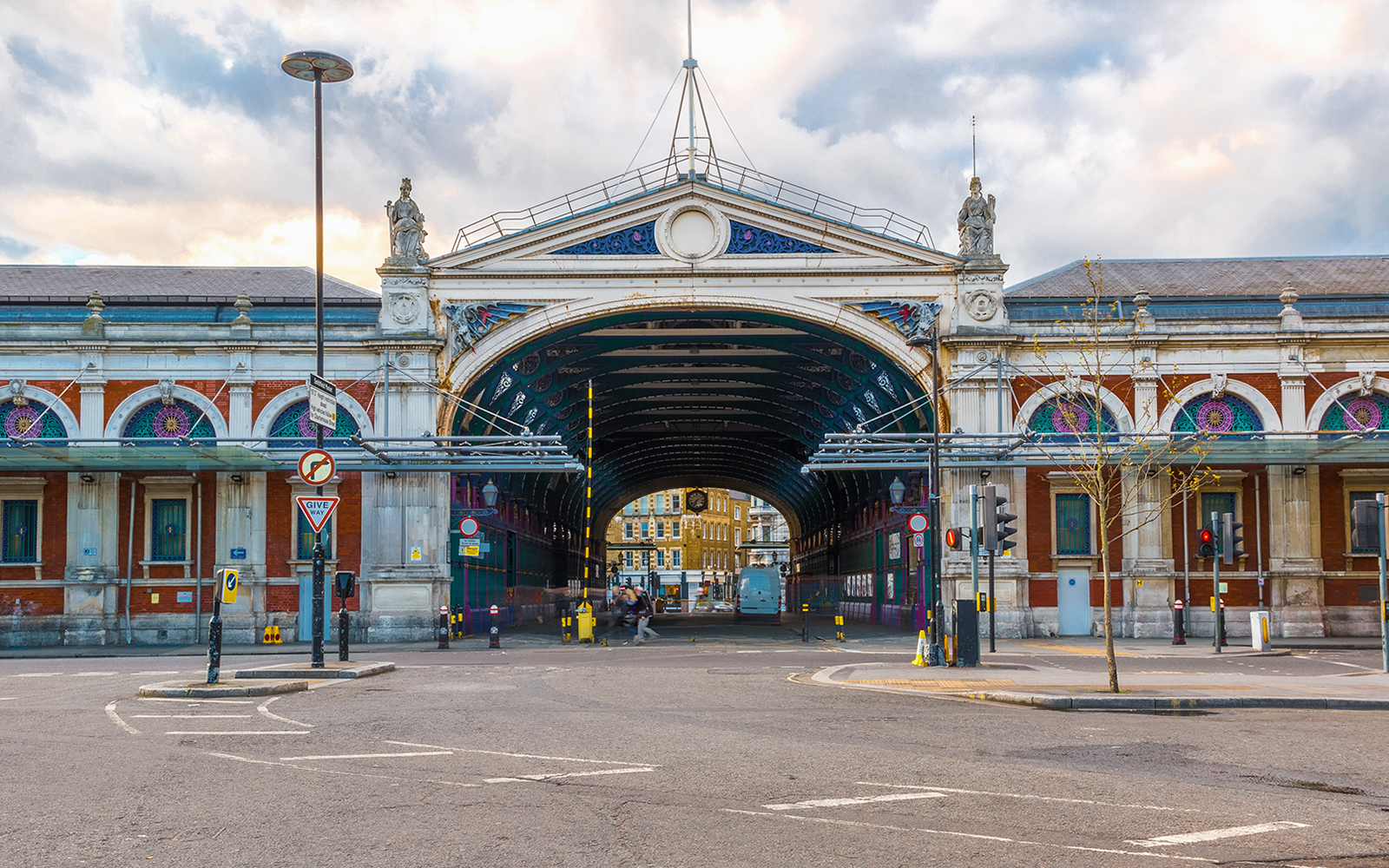 Smithfield Market exterior with arched entrance and decorative facade in London.