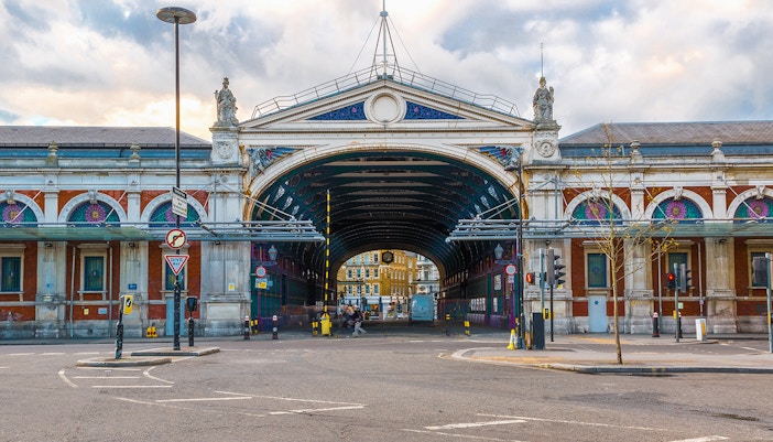 Smithfield Market exterior with arched entrance and decorative facade in London.