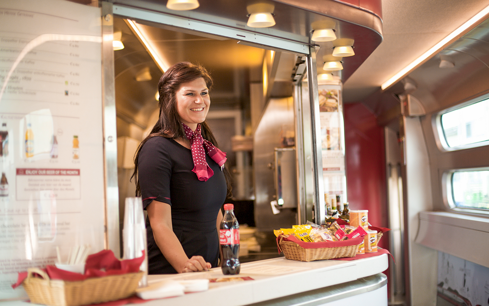 Train attendant serving snacks and drinks on Interrail Germany Mobile Pass Flex - 2nd Class.