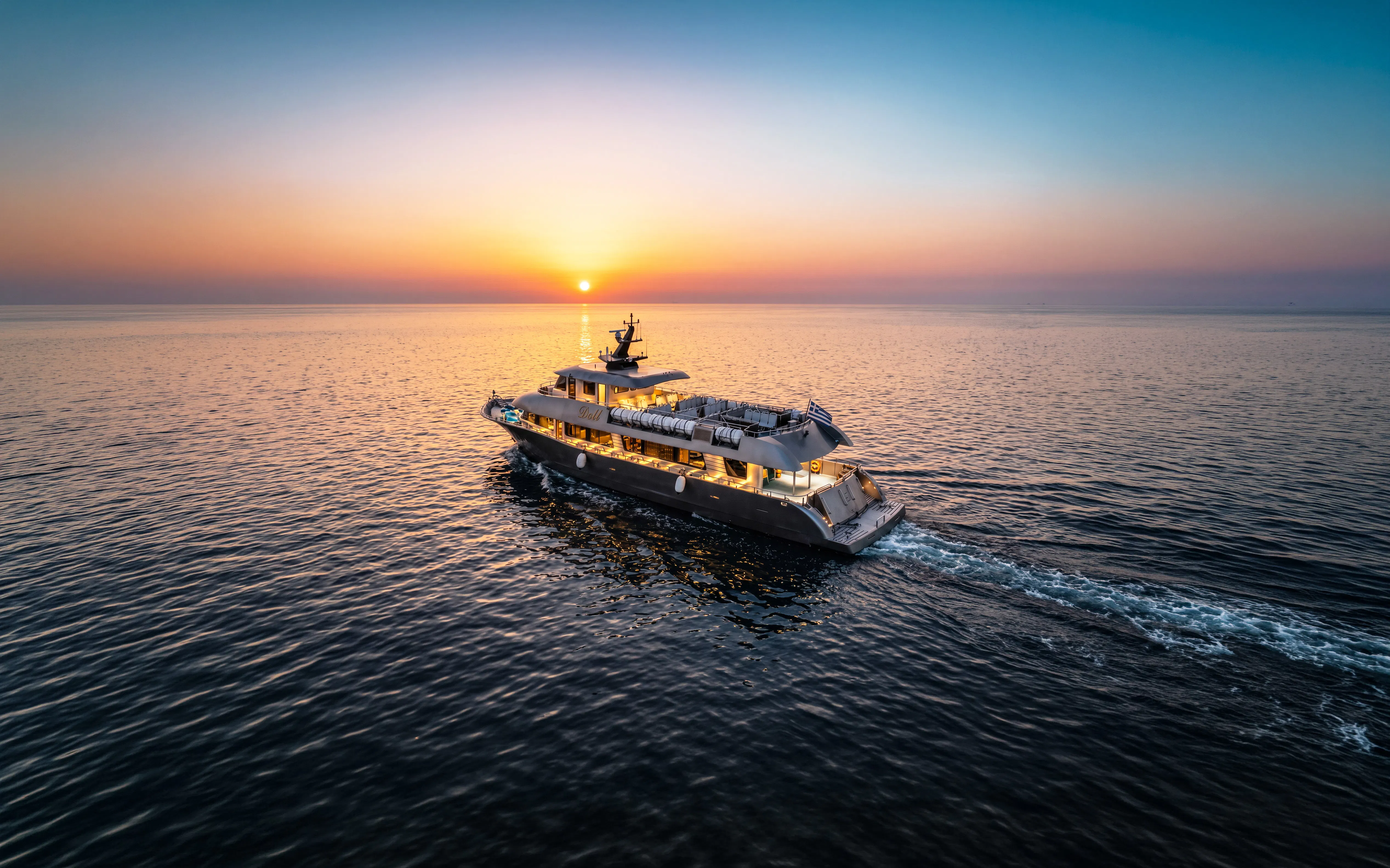 Cruise ship sailing at sunset on Rhodes evening cruise to Symi.