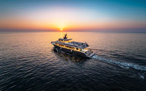 Cruise ship sailing at sunset on Rhodes evening cruise to Symi.