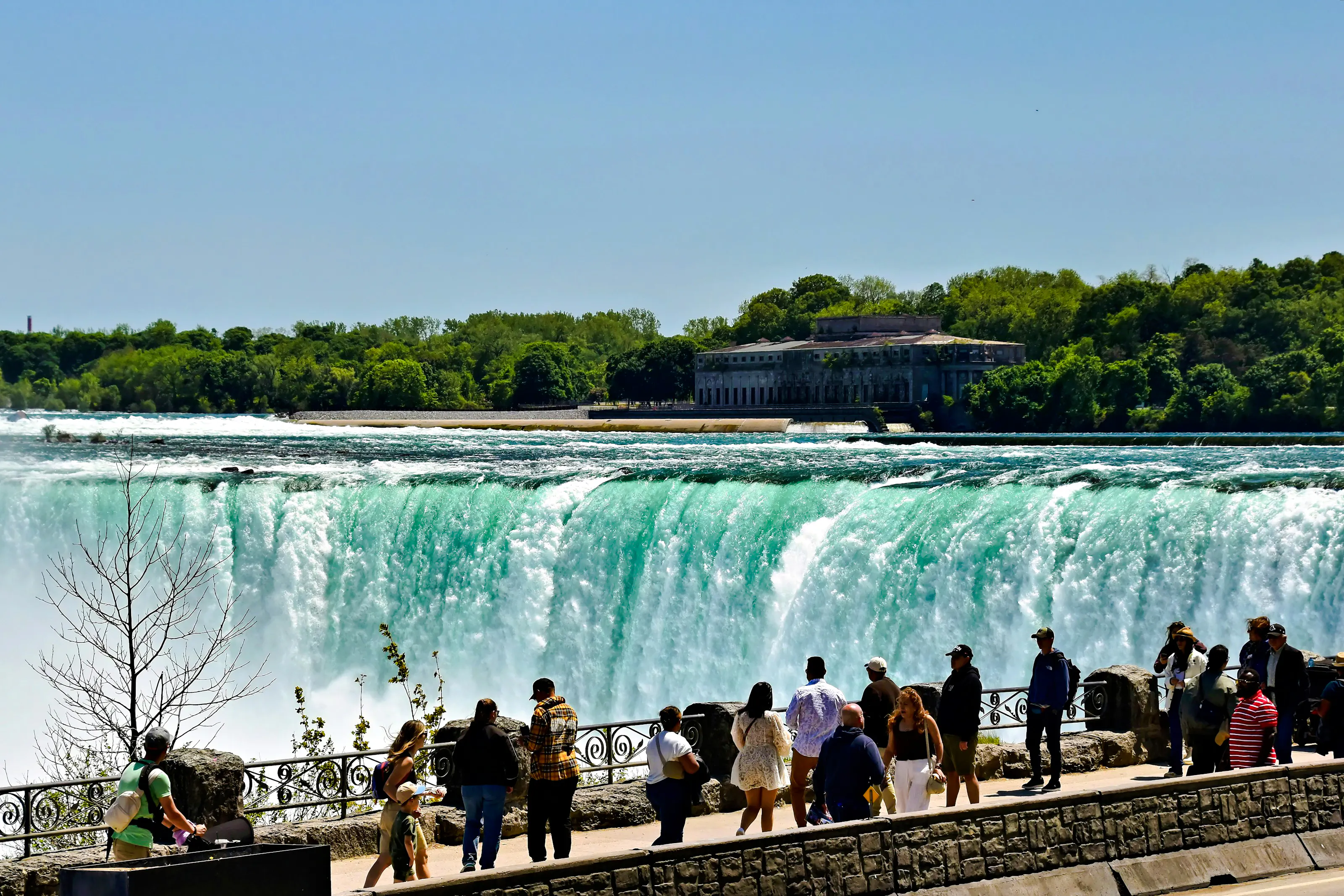 Visitors viewing Niagara Falls from a lookout point on a Toronto small-group tour.