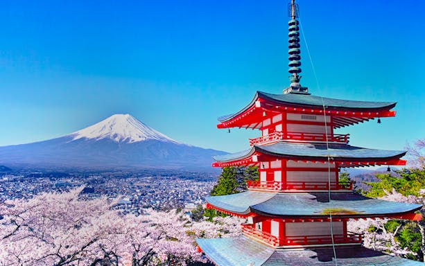 Pagoda with cherry blossoms and Mt. Fuji in Arakurayama Sengen Park, Japan.
