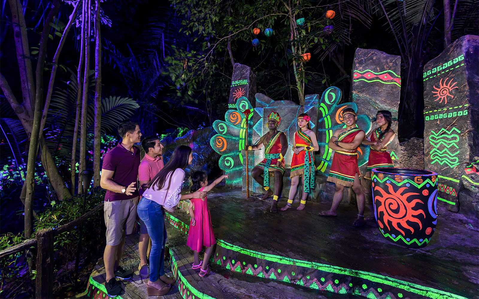 Visitors enjoying a cultural performance at Sunway Lost World of Tambun, Malaysia.