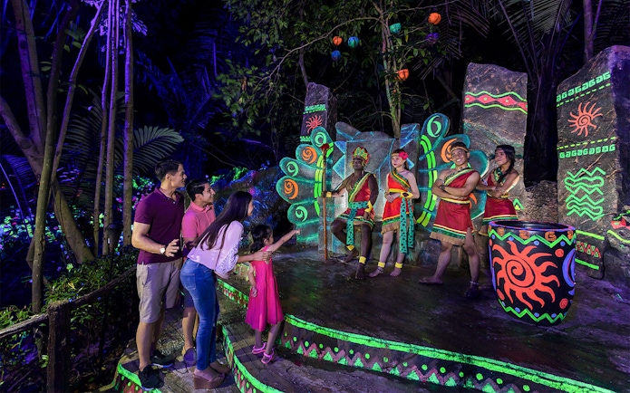 Visitors enjoying a cultural performance at Sunway Lost World of Tambun, Malaysia.