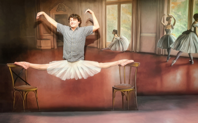 Man posing in a ballet illusion at the Museum of Fantastic Illusions.
