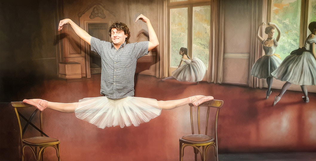Man posing in a ballet illusion at the Museum of Fantastic Illusions.