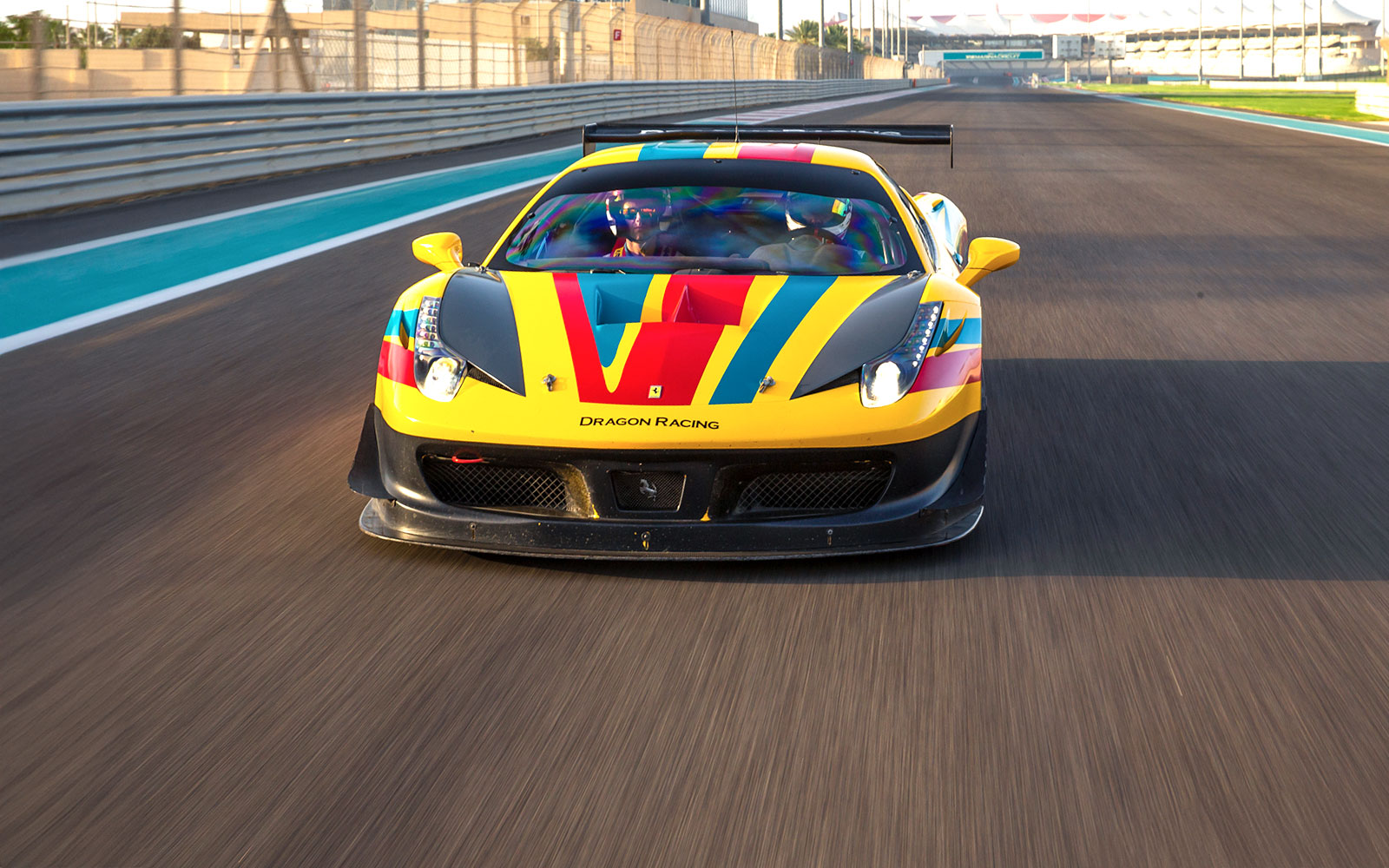 Ferrari 458 GT on track at Yas Marina Circuit during driving experience.