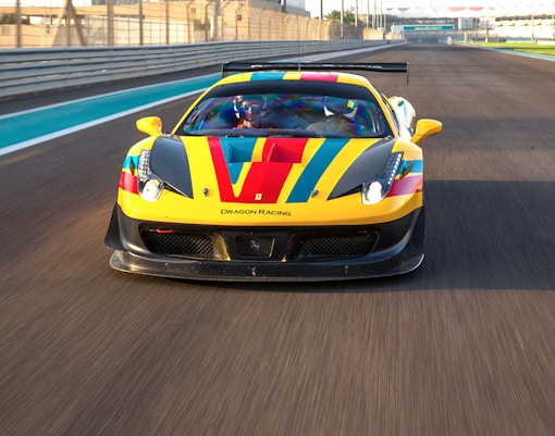 Ferrari 458 GT on track at Yas Marina Circuit during driving experience.