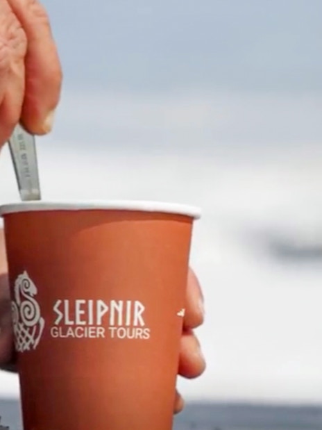 Coffee cup with Sleipnir Glacier Tours logo during Red Glacier Monster Truck Tour.