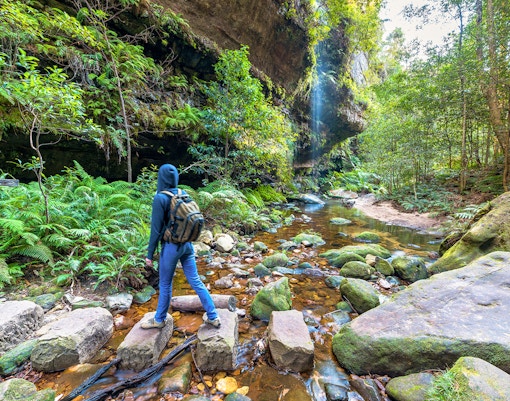 Tourist trekking the Grand Canyon Walking Track in the scenic Blue Mountains, Australia