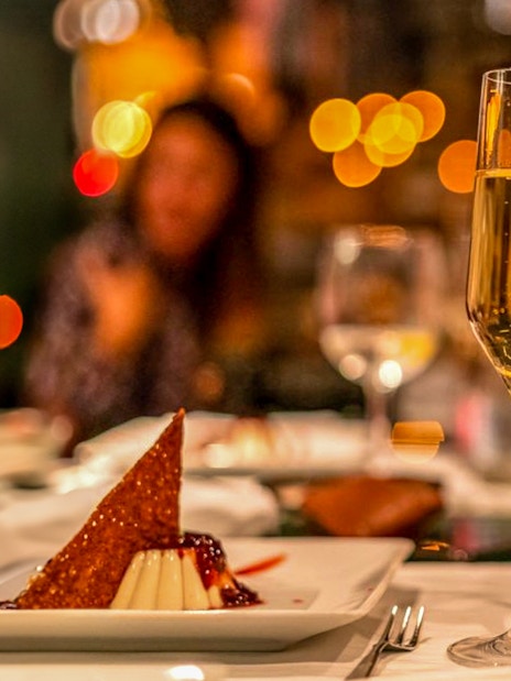 Champagne and dessert on a table during Budapest dinner cruise.