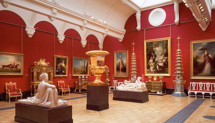 King's Gallery at Buckingham Palace with sculptures, paintings, and ornate decor.