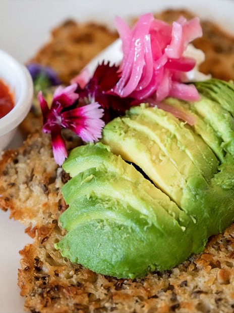Avocado toast with pickled onions and flowers, served with a side of salsa on the Mary Valley Rattler Train.