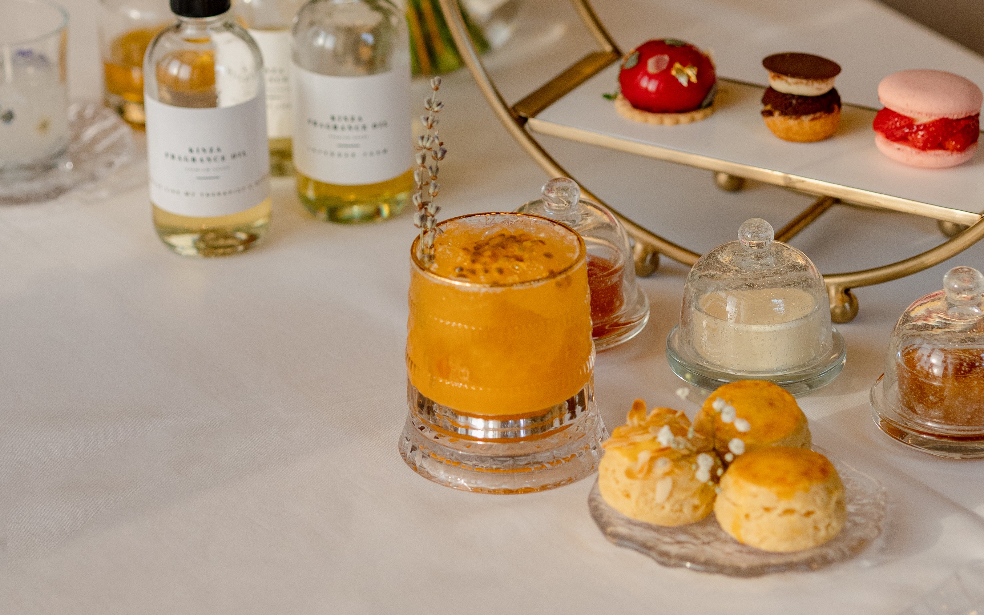 Afternoon tea setup with pastries and a drink at The Samovar Lounge, Dubai.