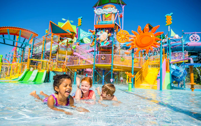 Children playing in the water at Walkabout Waters slides, Aquatica Orlando.
