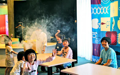 Children engaging in a science activity at Okinawa Zoo & Museum.