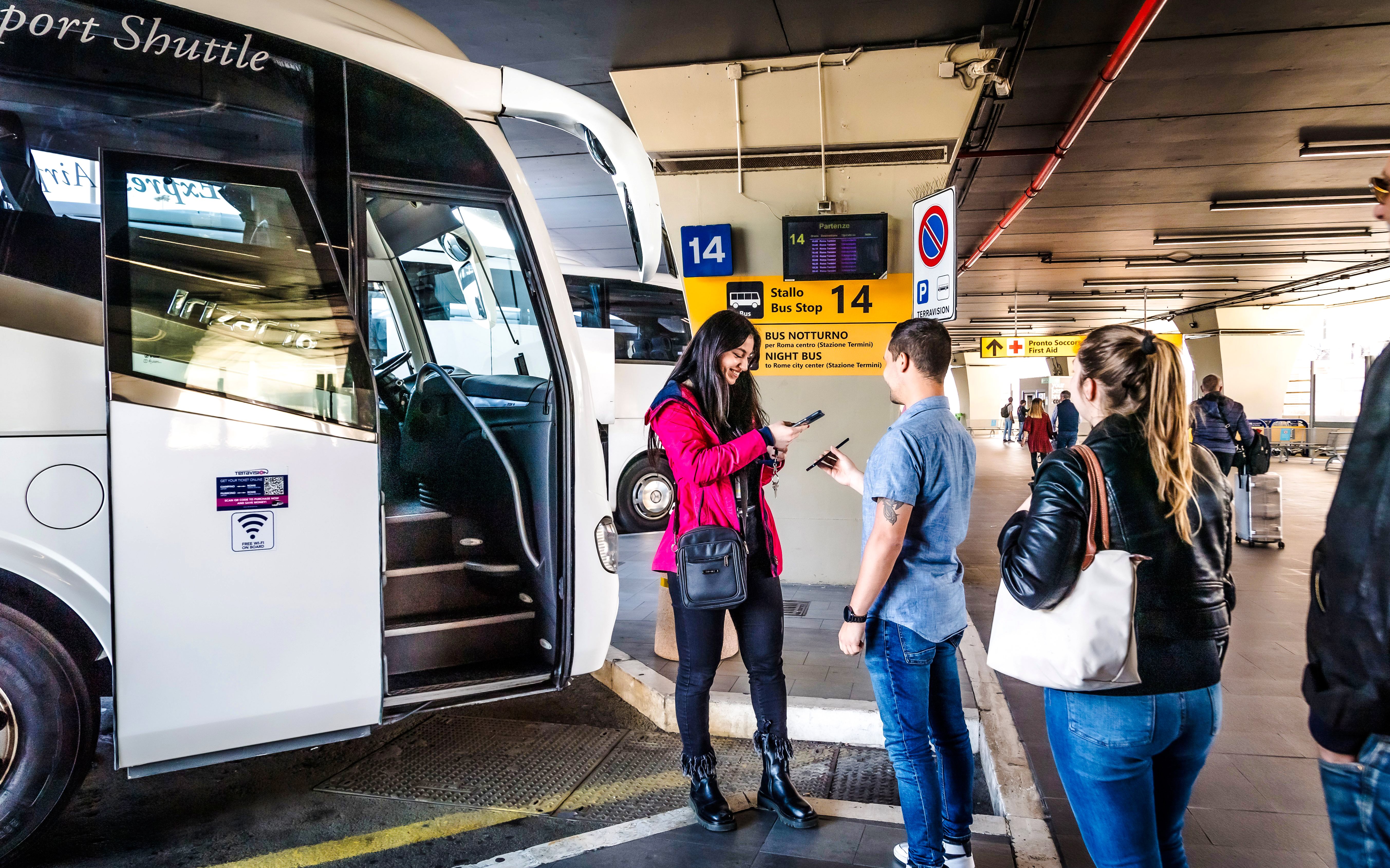 Passengers boarding Terravision bus at Fiumicino Airport bus stop 14.