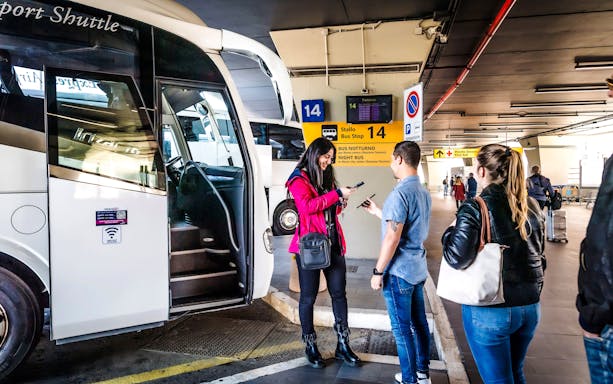 Passengers boarding Terravision bus at Fiumicino Airport bus stop 14.