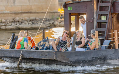 Tourists relaxing on a traditional Galar cruise on the Vistula River.