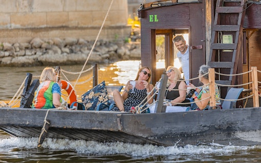 Tourists relaxing on a traditional Galar cruise on the Vistula River.