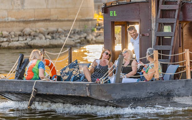 Tourists relaxing on a traditional Galar cruise on the Vistula River.
