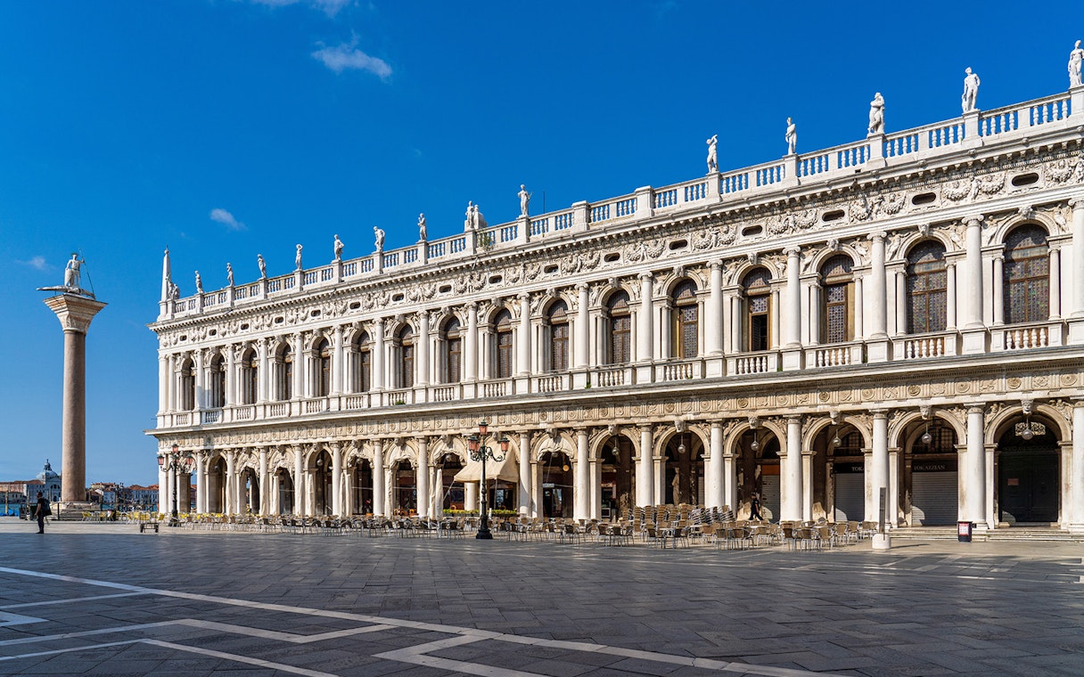 Marciana Library facade in Renaissance style, Venice, with statues and columns.