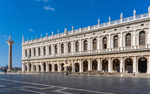 Marciana Library facade in Renaissance style, Venice, with statues and columns.