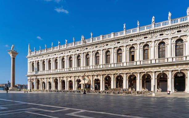 Marciana Library facade in Renaissance style, Venice, with statues and columns.