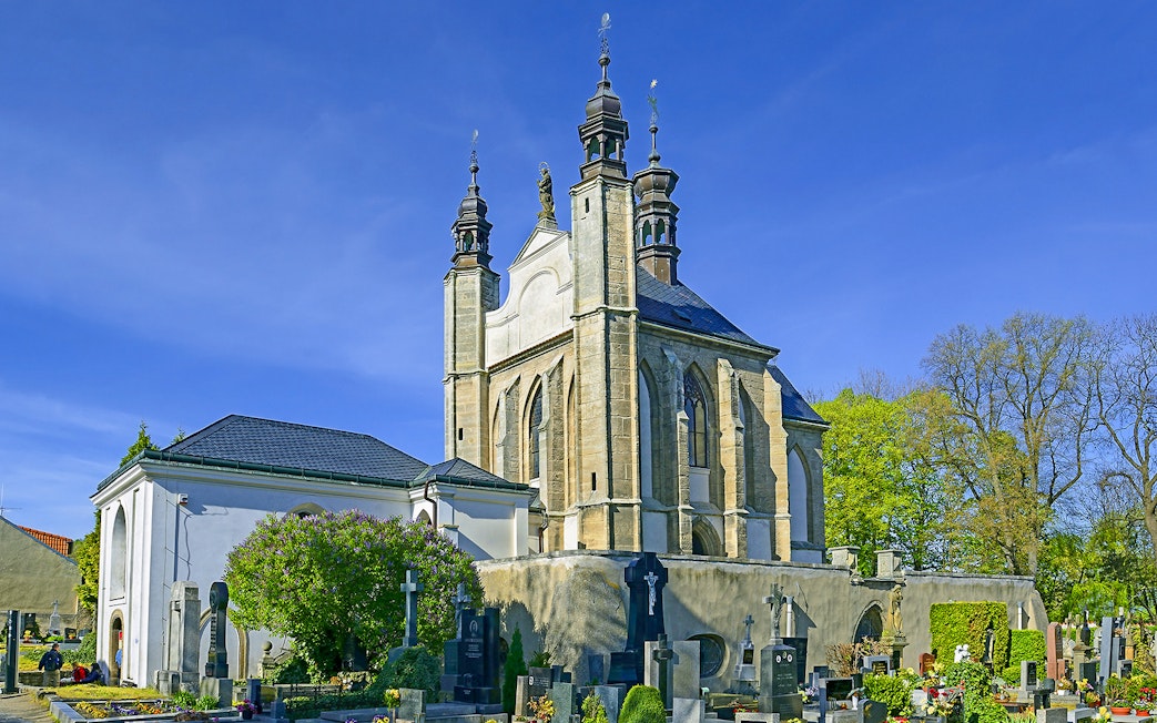 Kutna Hora church with cemetery on a sunny day during half-day tour.