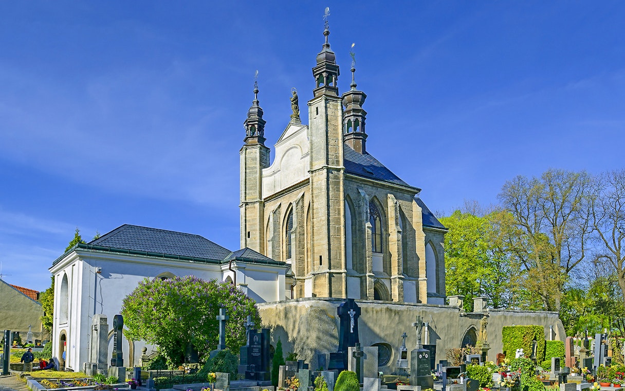 Kutna Hora church with cemetery on a sunny day during half-day tour.