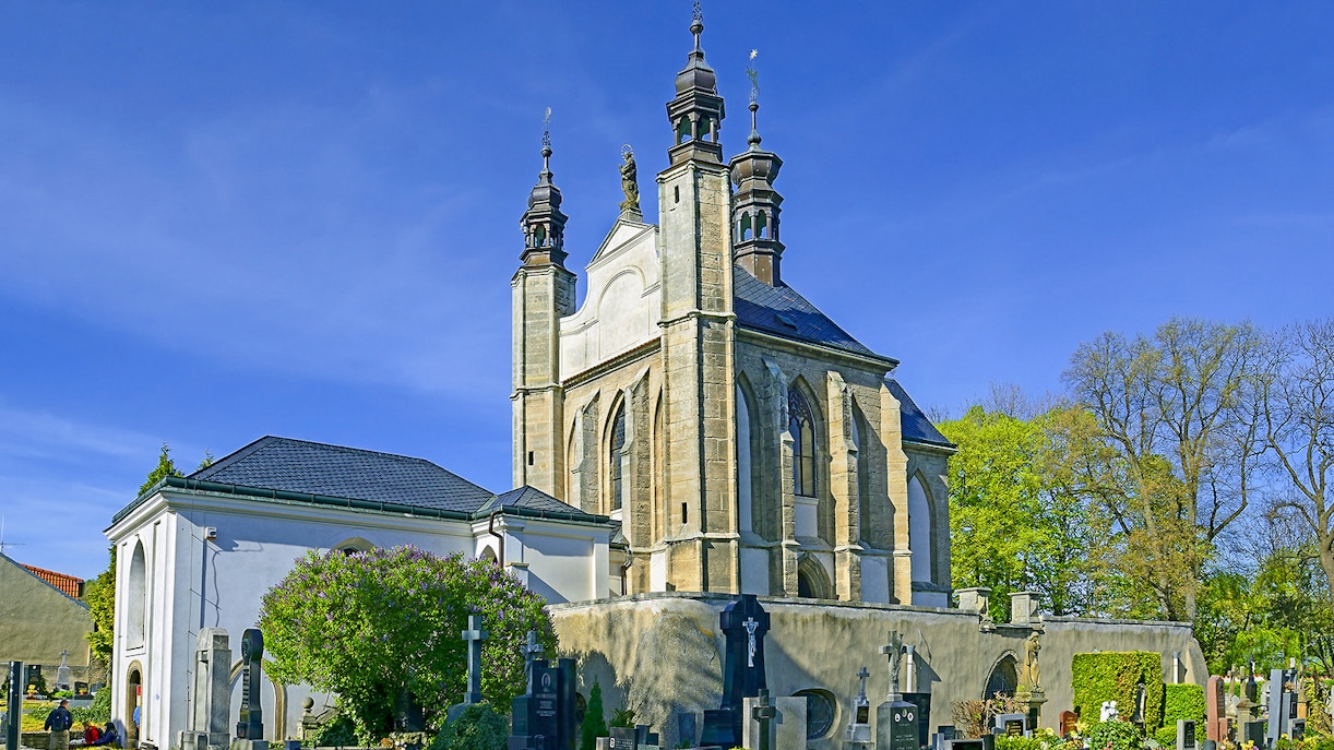 Kutna Hora church with cemetery on a sunny day during half-day tour.