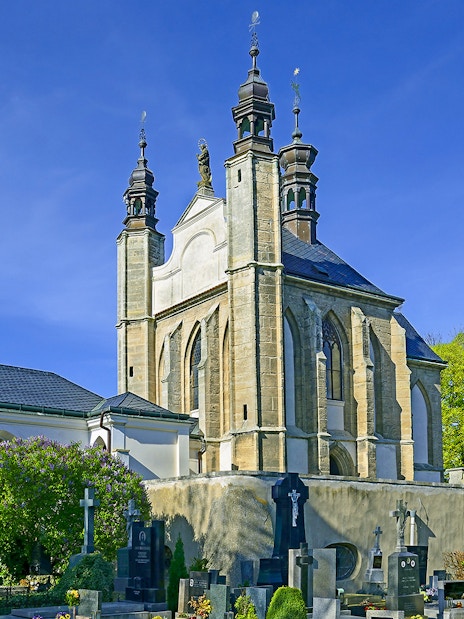 Kutna Hora church with cemetery on a sunny day during half-day tour.