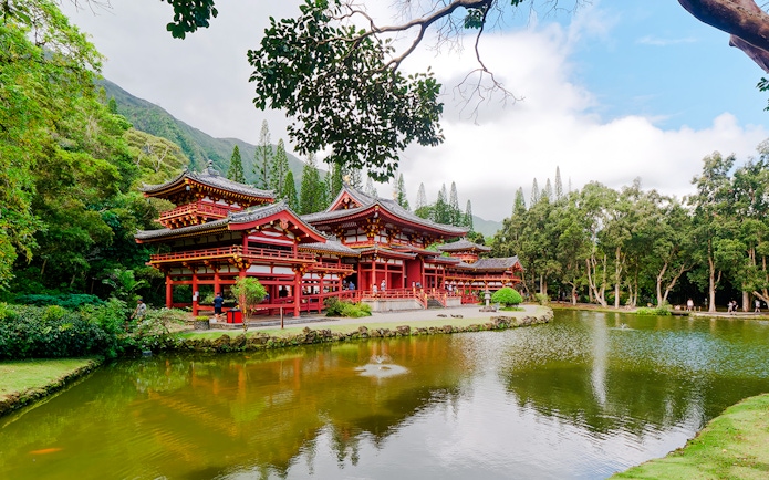 Byodo-In Temple with pond and lush greenery, Valley of the Temples, Oahu, Hawaii.