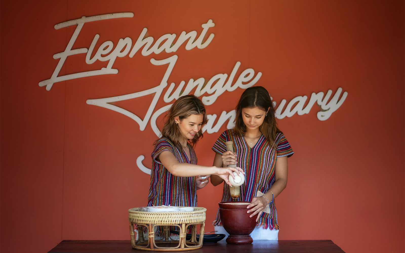 Two people preparing food at Elephant Jungle Sanctuary Samui.