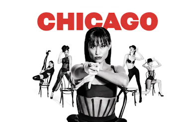 Performers in black costumes with chairs, promoting the musical "Chicago.