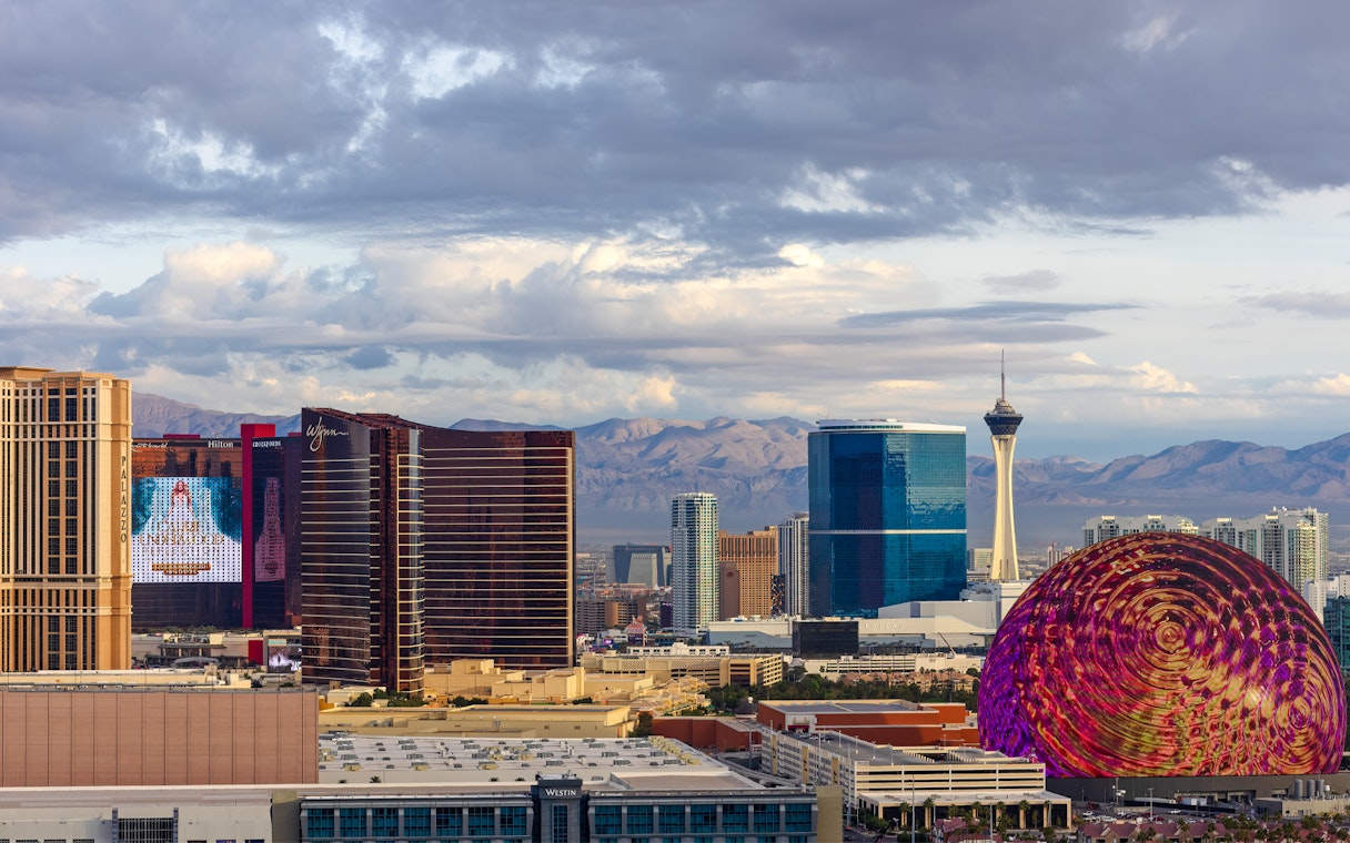 Las Vegas skyline with Stratosphere Tower and colorful dome structure.