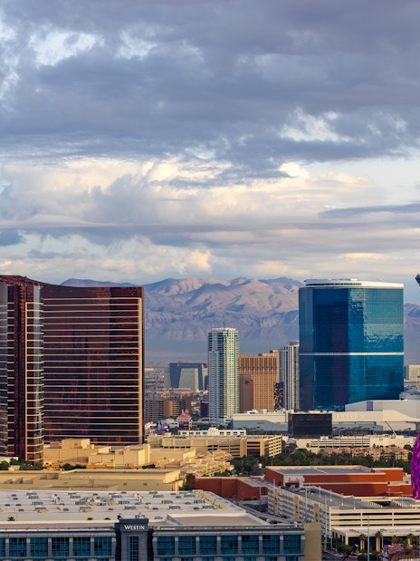 Las Vegas skyline with Stratosphere Tower and colorful dome structure.