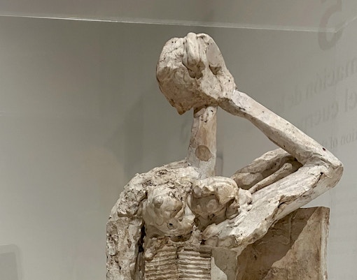 Sculpture at Picasso Museum in Malaga showcasing abstract art style.