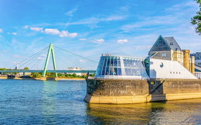 Cologne Harbour with modern building and bridge over the Rhine River.