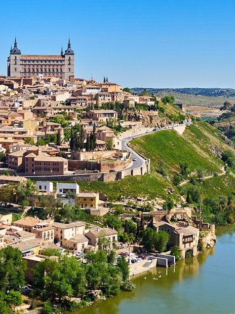 Toledo cityscape from Mirador del Valle with Alcázar and Tagus River.