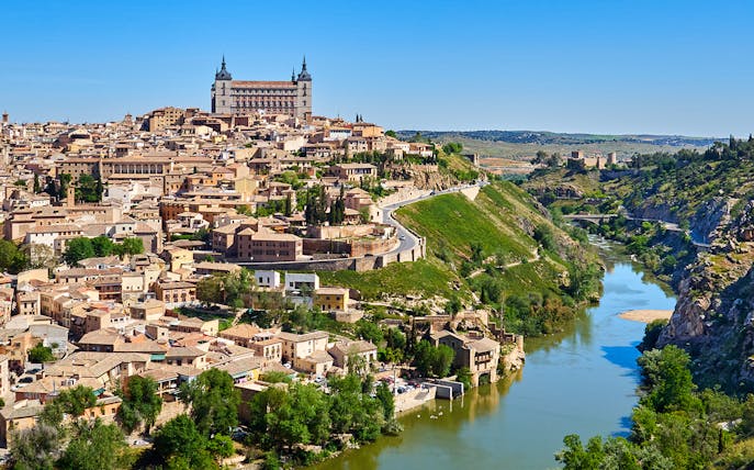 Toledo cityscape from Mirador del Valle with Alcázar and Tagus River.