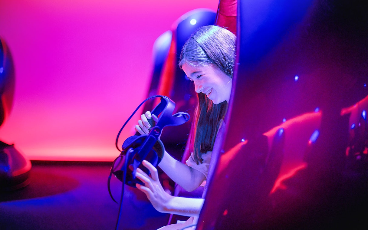Person enjoying virtual reality experience at Melbourne Skydeck.