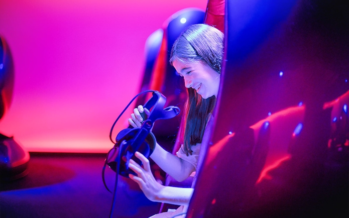 Person enjoying virtual reality experience at Melbourne Skydeck.