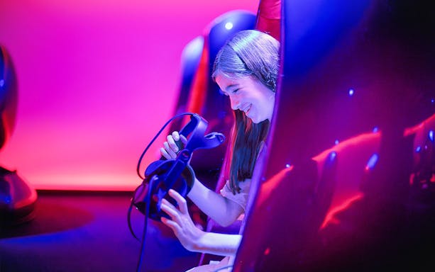 Person enjoying virtual reality experience at Melbourne Skydeck.