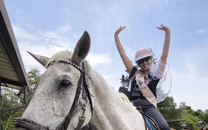 Horseback rider enjoying Tuscany countryside tour in Chianti.