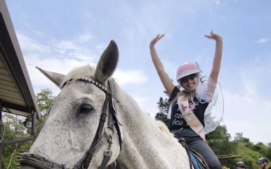 Horseback rider enjoying Tuscany countryside tour in Chianti.