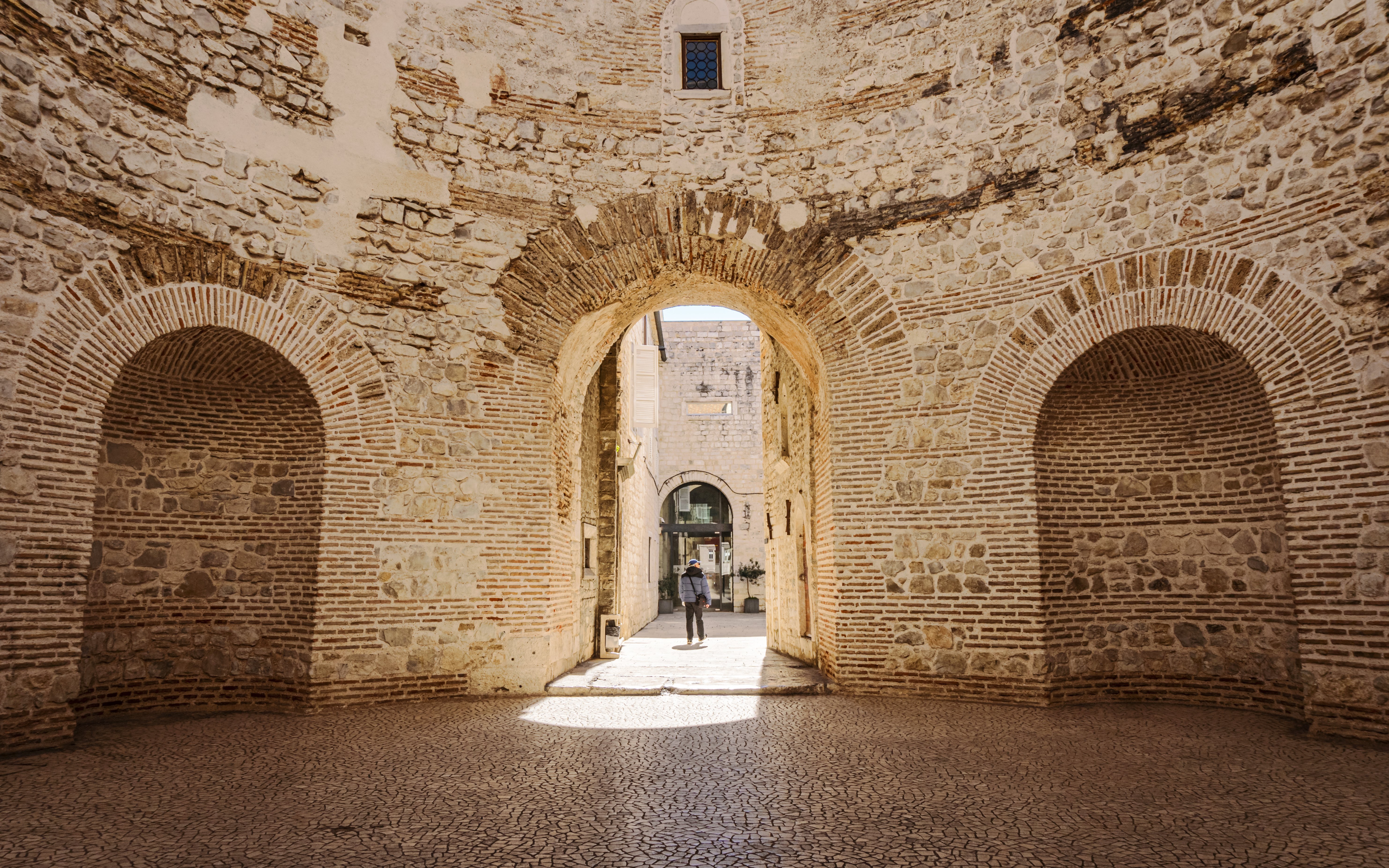 Interior view of the vestibule in Diocletian's Palace, Split, Croatia, showcasing ancient stone arches.